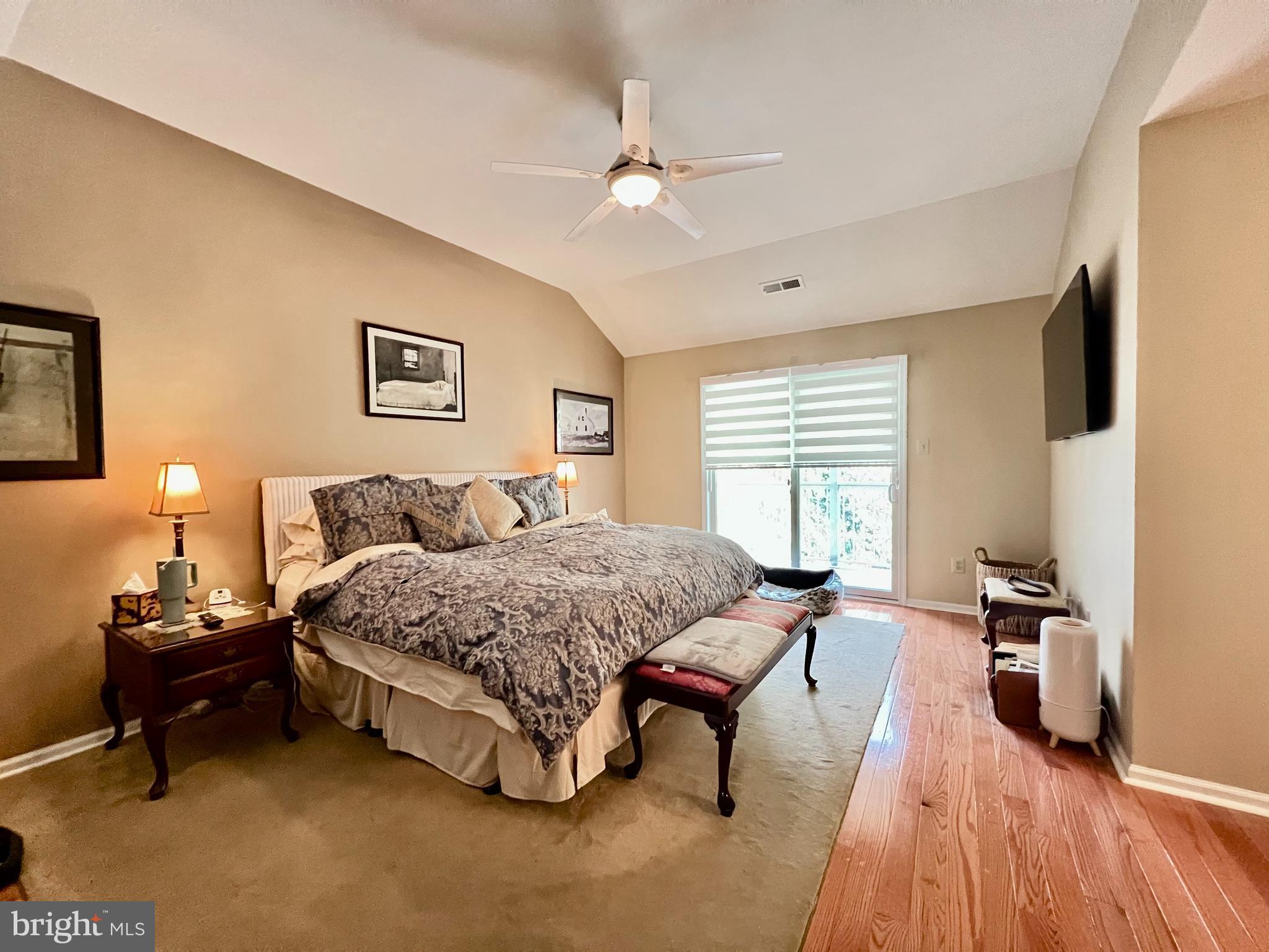 668 Greycliffe Lane Lower Gwynedd, PA 19002 - Photo 16 of 33 a living room with a bed furniture and a flat screen tv