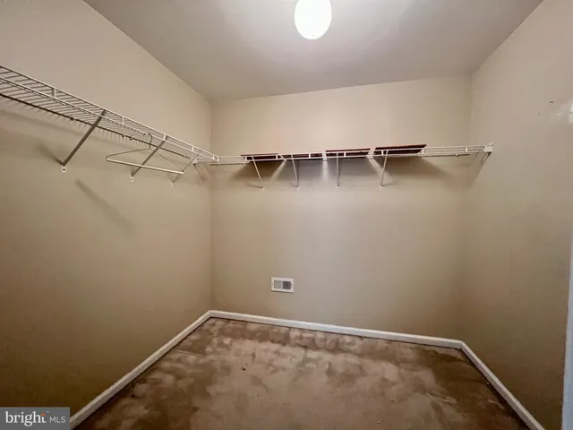 a view of a room with racks on the wall