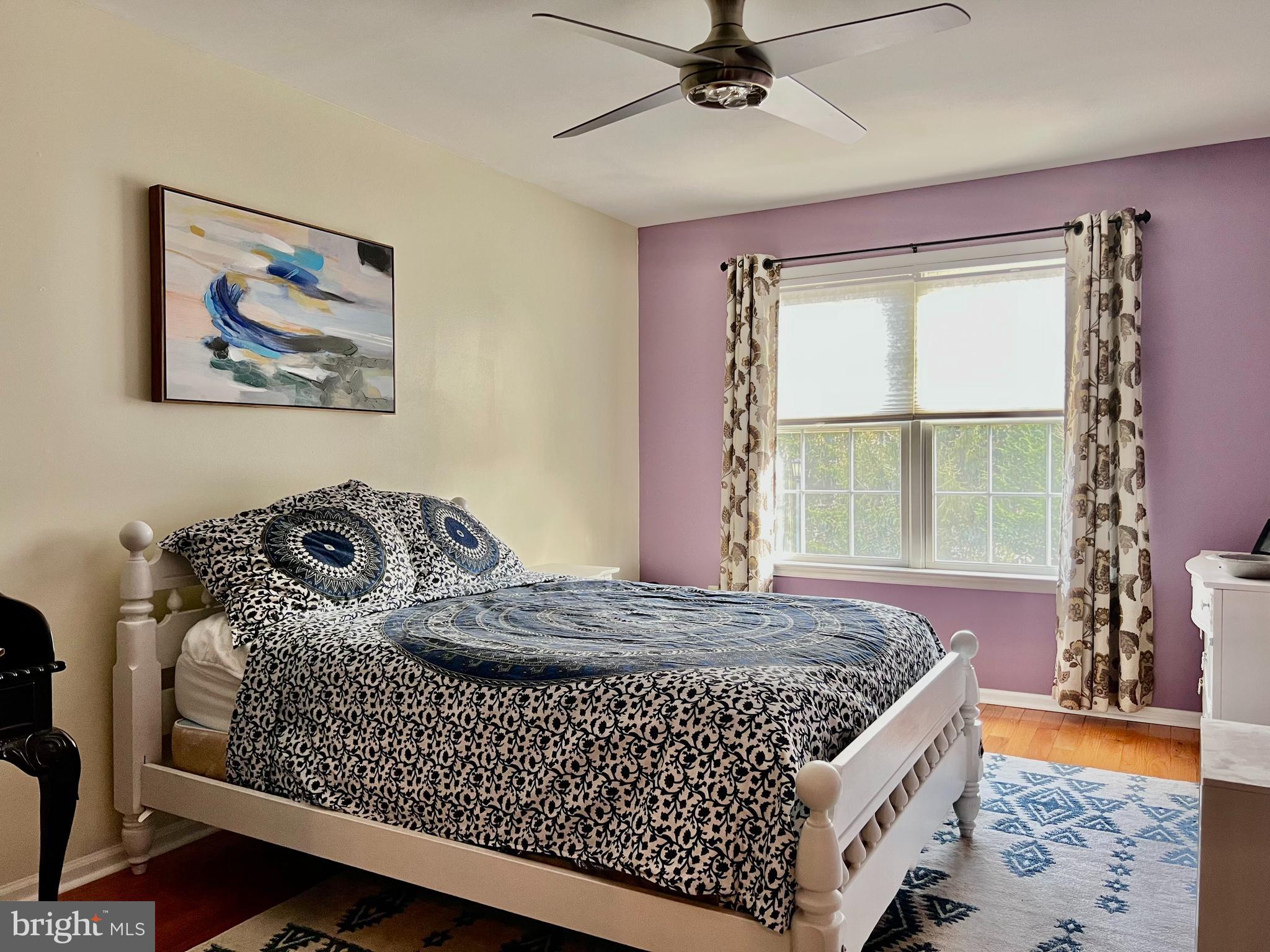 668 Greycliffe Lane Lower Gwynedd, PA 19002 - Photo 23 of 33 a bedroom with a bed and a window