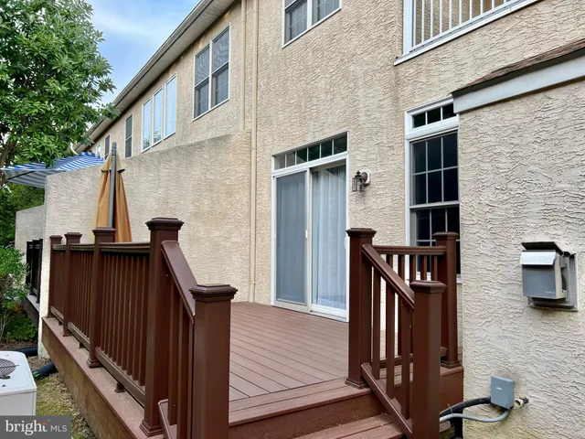 a front view of a house with wooden stairs