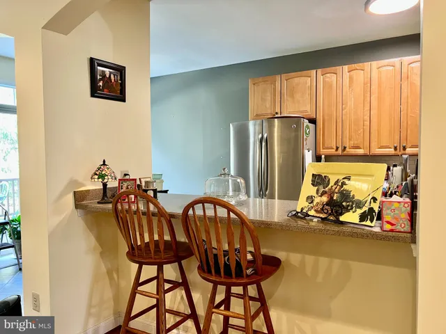 a view of a dining room with furniture and a window