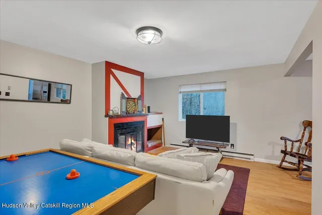 a living room with furniture pool and a table