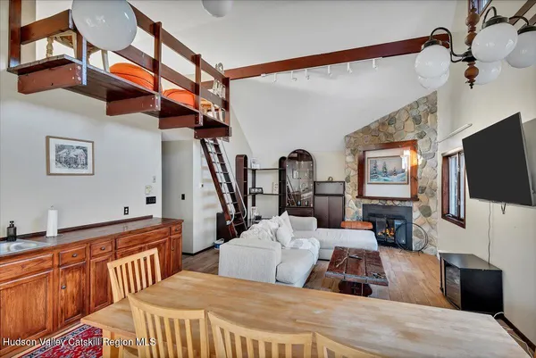 a bedroom with furniture and a flat screen tv