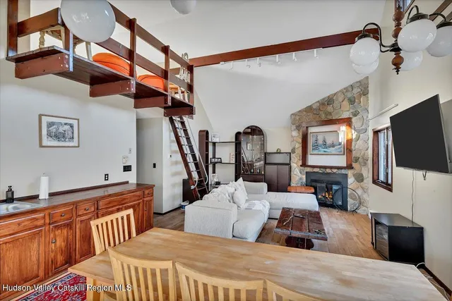 a bedroom with furniture and a flat screen tv