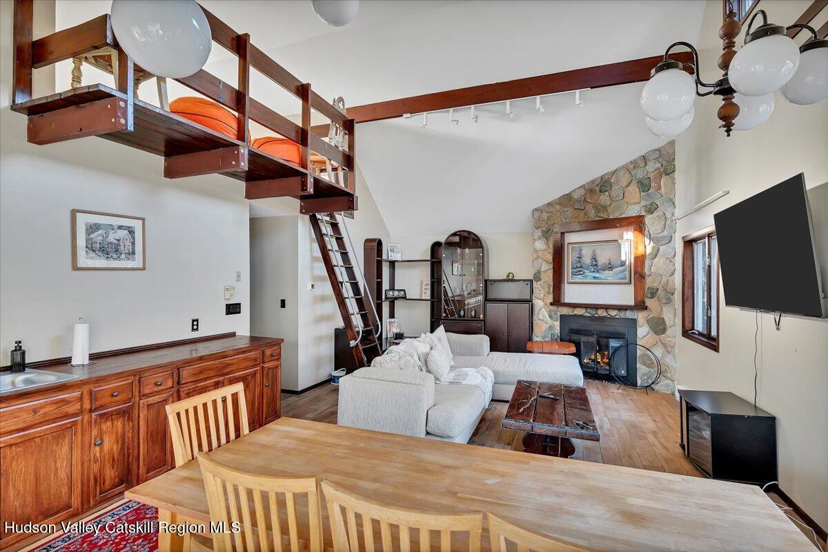 114 Ford Hill Road Hunter, NY 12442 - Photo 18 of 40 a bedroom with furniture and a flat screen tv