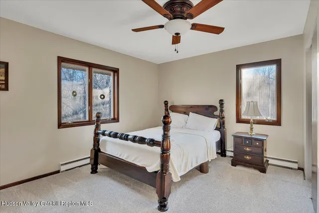 a bed room with a bed and a television