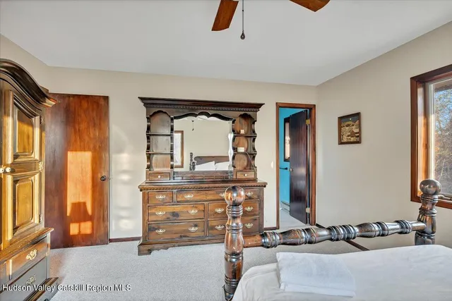 a bathroom with a sink toilet and mirror