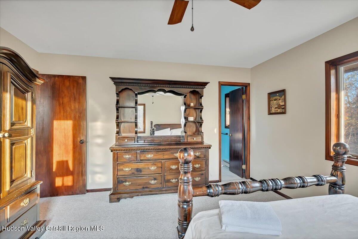 114 Ford Hill Road Hunter, NY 12442 - Photo 28 of 40 a bed room with a bed and a television