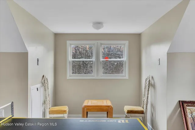 a room with furniture pool table and table