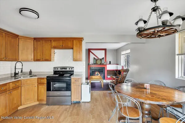a kitchen with stainless steel appliances granite countertop a cabinets sink and stove