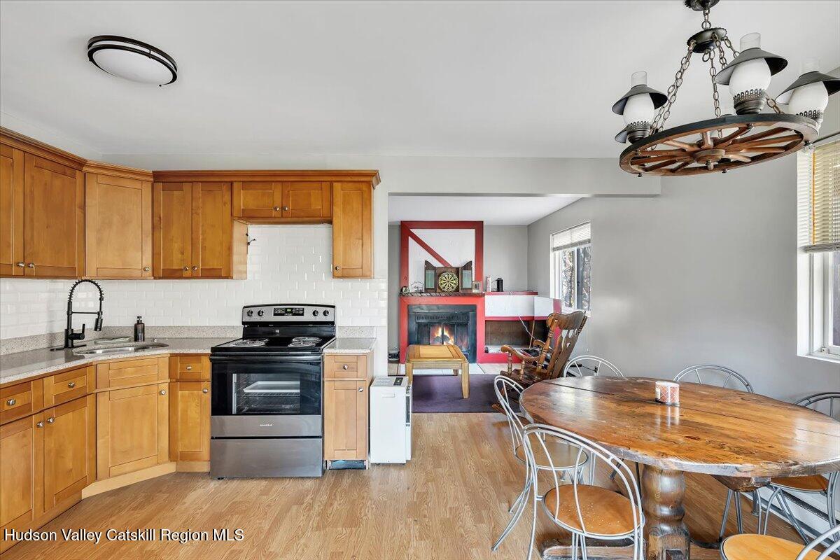 114 Ford Hill Road Hunter, NY 12442 - Photo 5 of 40 a kitchen with stainless steel appliances granite countertop a cabinets sink and stove