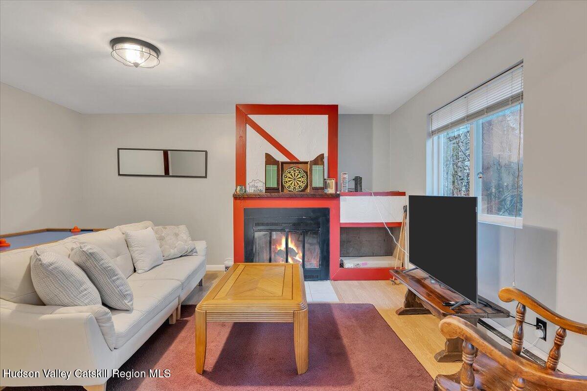 114 Ford Hill Road Hunter, NY 12442 - Photo 9 of 40 a living room with furniture fireplace and rug
