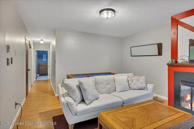 a living room with furniture and a rug