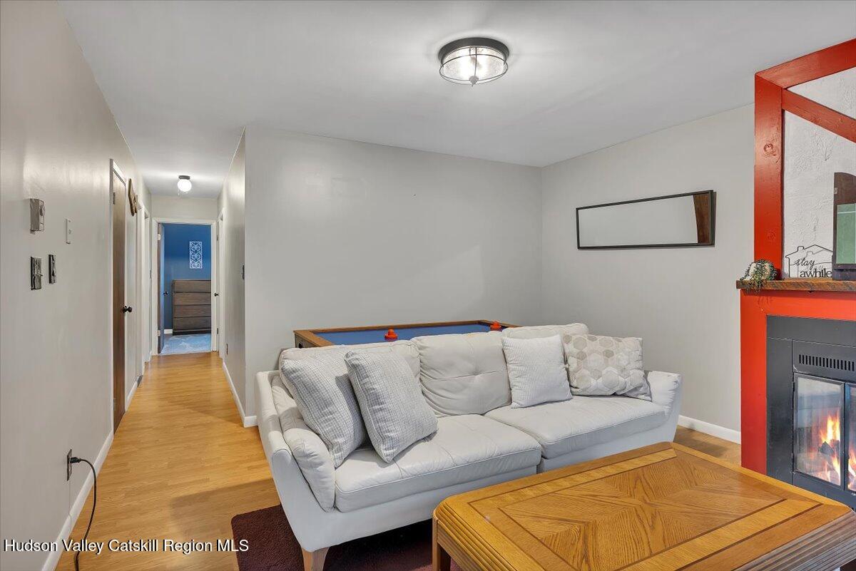 114 Ford Hill Road Hunter, NY 12442 - Photo 10 of 40 a living room with furniture and a rug