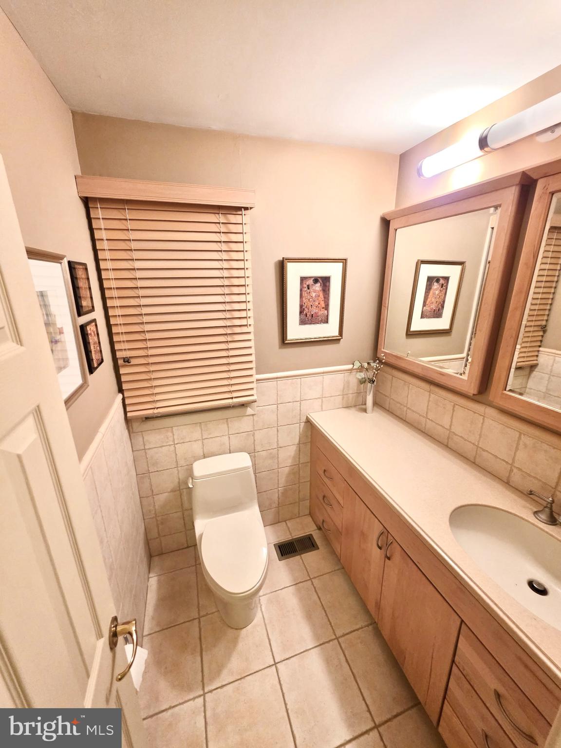 992 Sheffield Lane Huntingdon Valley, PA 19006 - Photo 16 of 31 a bathroom with a sink and a mirror