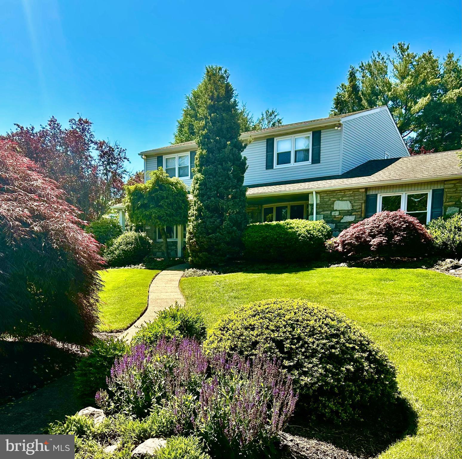 992 Sheffield Lane Huntingdon Valley, PA 19006 - Photo 2 of 31 a view of a big yard with potted plants and a large tree
