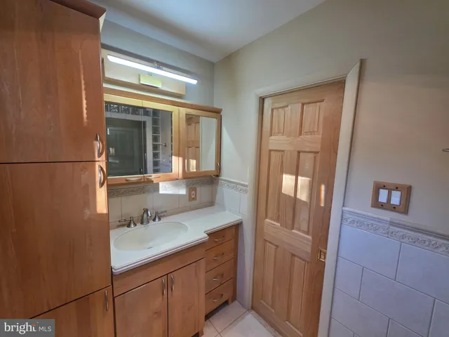 a bathroom with a toilet a sink and shower