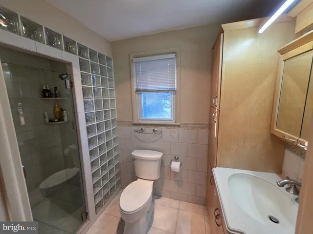 a bed room with bed and window