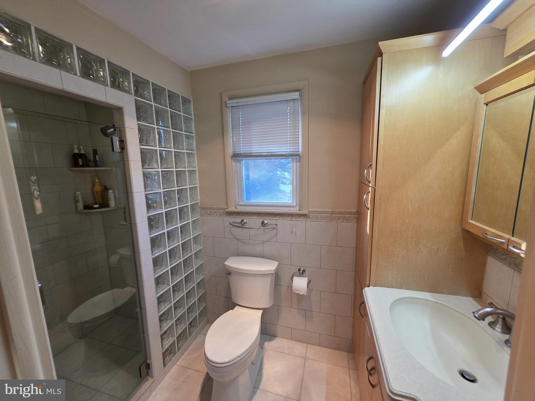 992 Sheffield Lane Huntingdon Valley, PA 19006 - Photo 22 of 31 a bathroom with a toilet a sink and shower