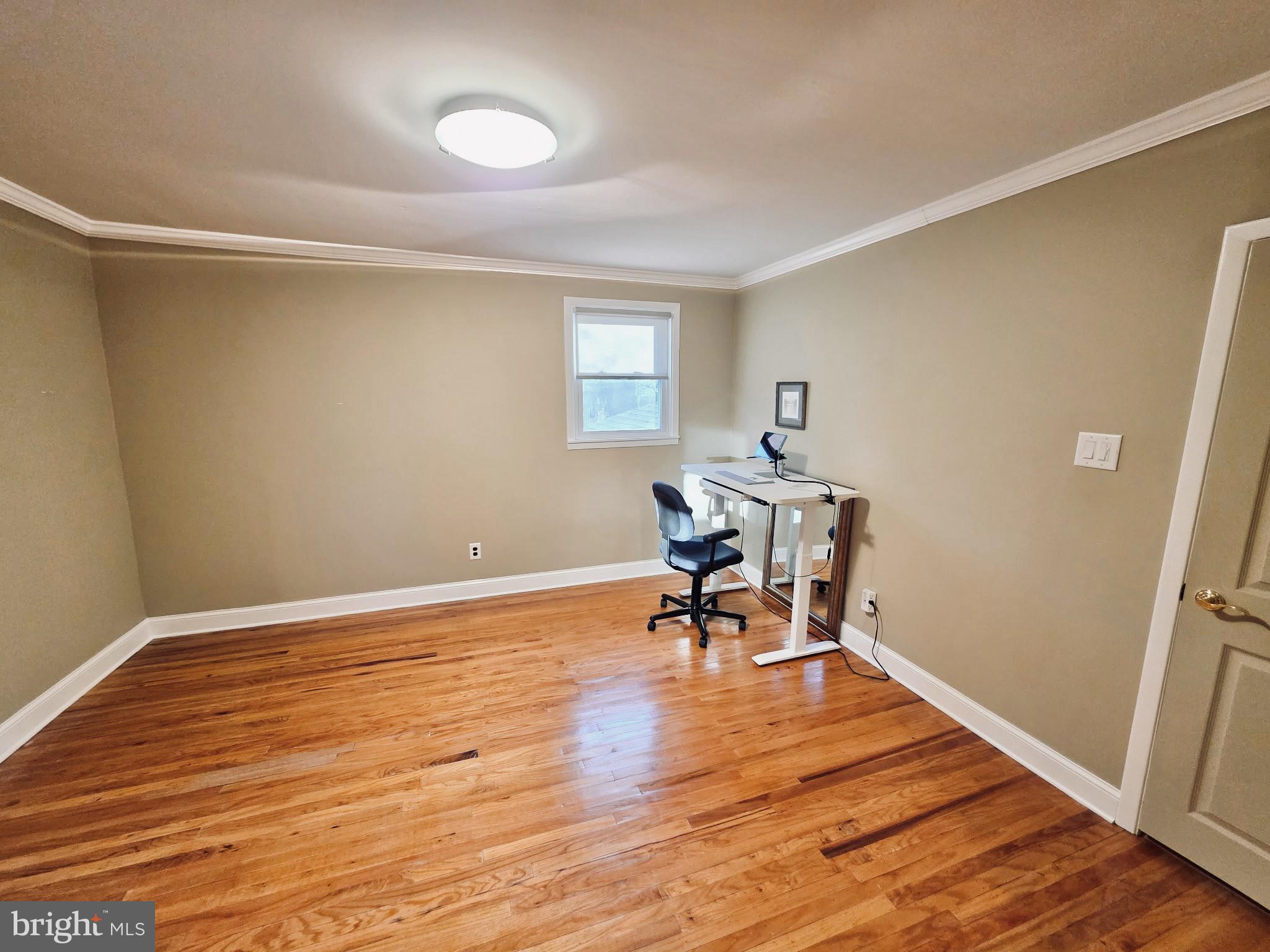 992 Sheffield Lane Huntingdon Valley, PA 19006 - Photo 24 of 31 a view of a workspace with wooden floor and a window
