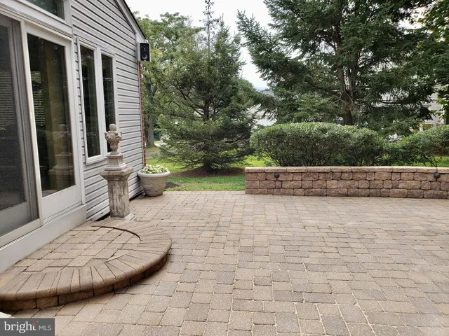 a view of a couches in patio of back yard