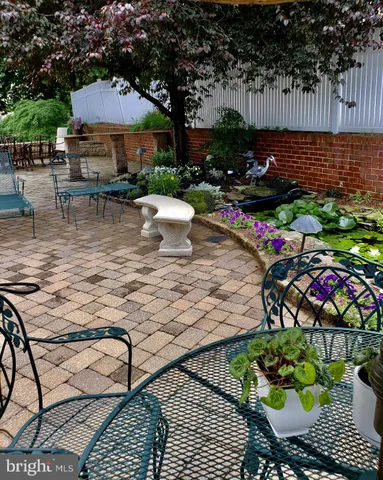 a view of a chairs and tables in the patio