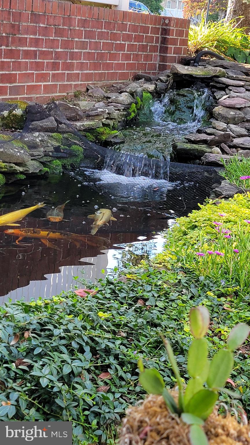 992 Sheffield Lane Huntingdon Valley, PA 19006 - Photo 8 of 31 a backyard of a house with a yard and outdoor seating