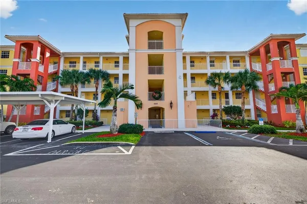 a front view of building with cars