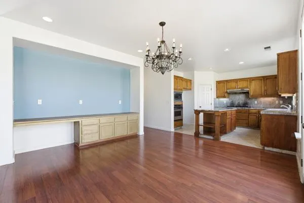 a kitchen with a stove a sink and a refrigerator
