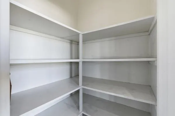 a view of empty room with ceiling fan