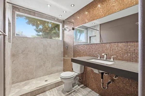 a view of a livingroom with furniture workspace and a window