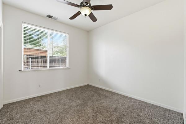 384 Millbrook Street Hanford, CA 93230 - Photo 26 of 59 a view of an empty room with a window