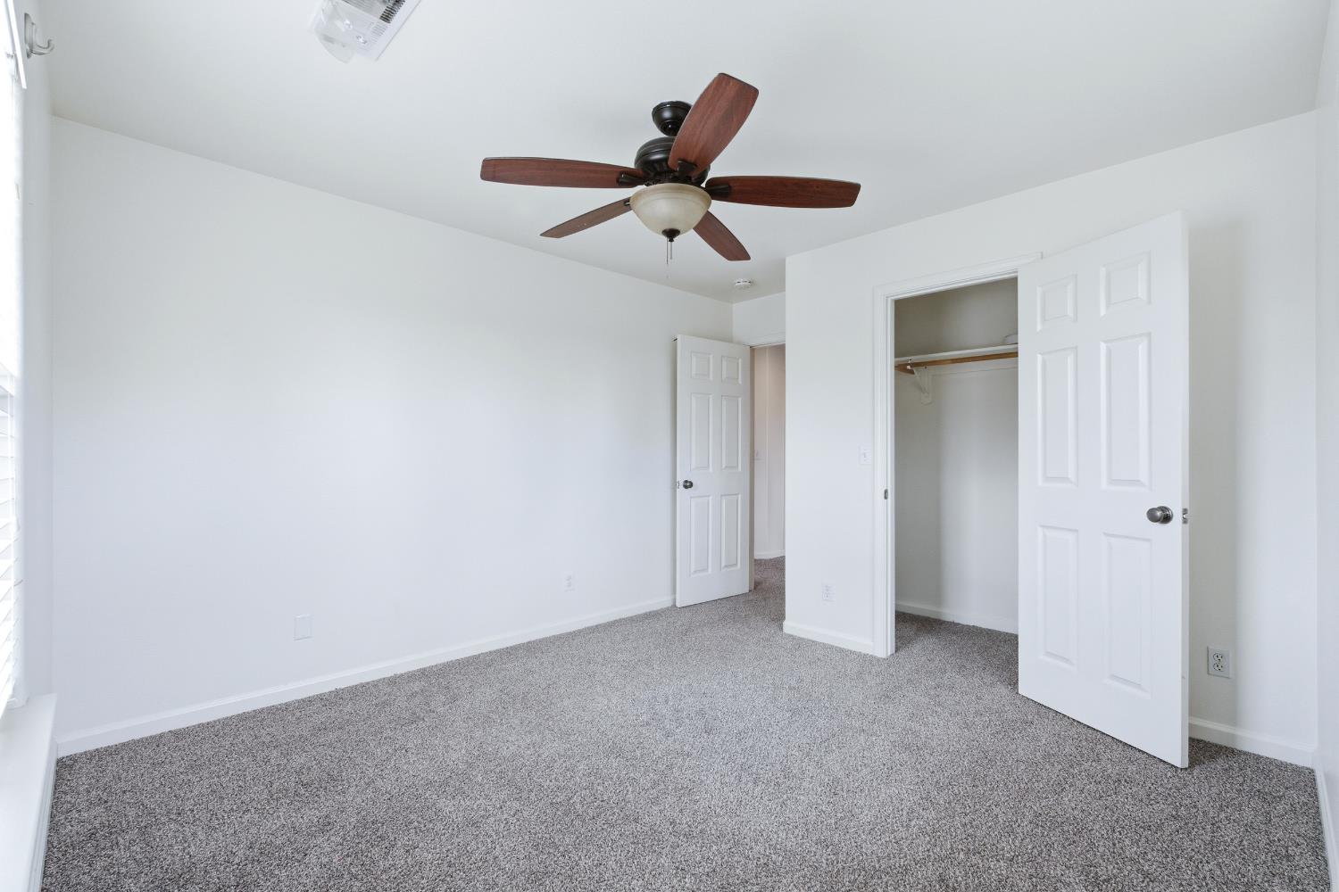 384 Millbrook Street Hanford, CA 93230 - Photo 27 of 59 a view of empty room with ceiling fan