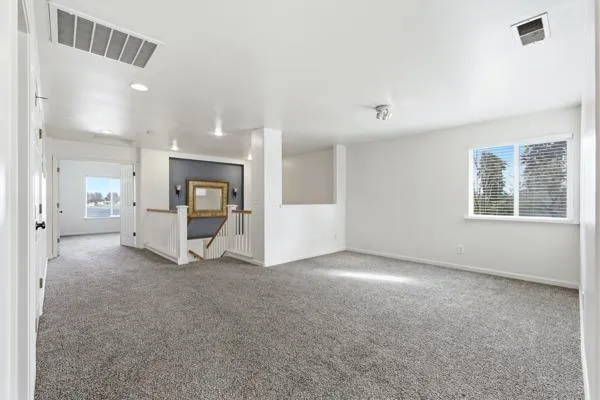 a white toilet sitting next to a bath tub