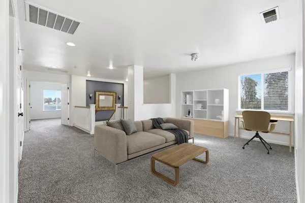 a view of empty room with a ceiling fan