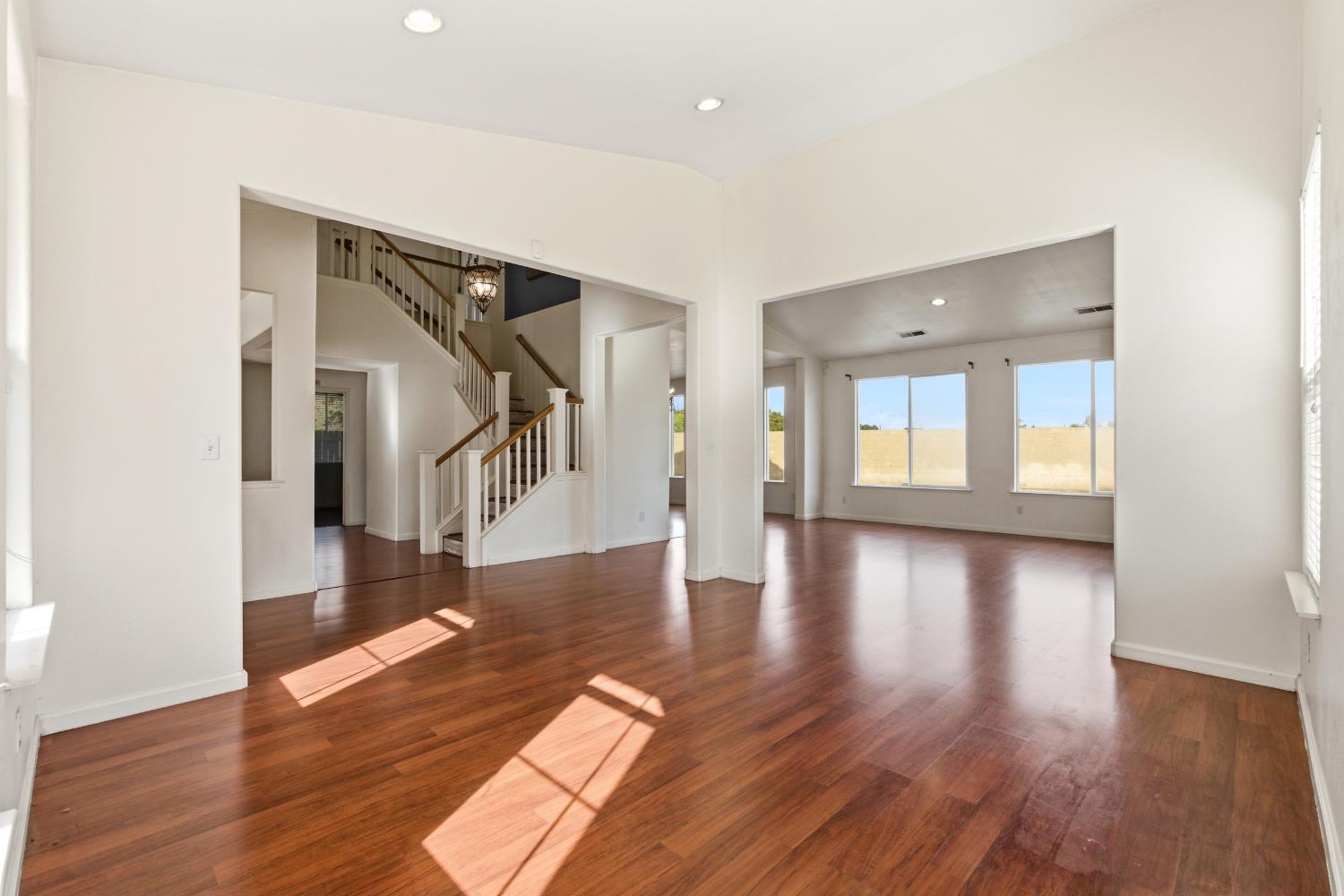 384 Millbrook Street Hanford, CA 93230 - Photo 4 of 59 a view of empty room with wooden floor and stairs