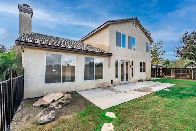 a aerial view of a house with backyard