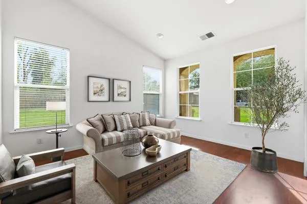 a living room with furniture and a window