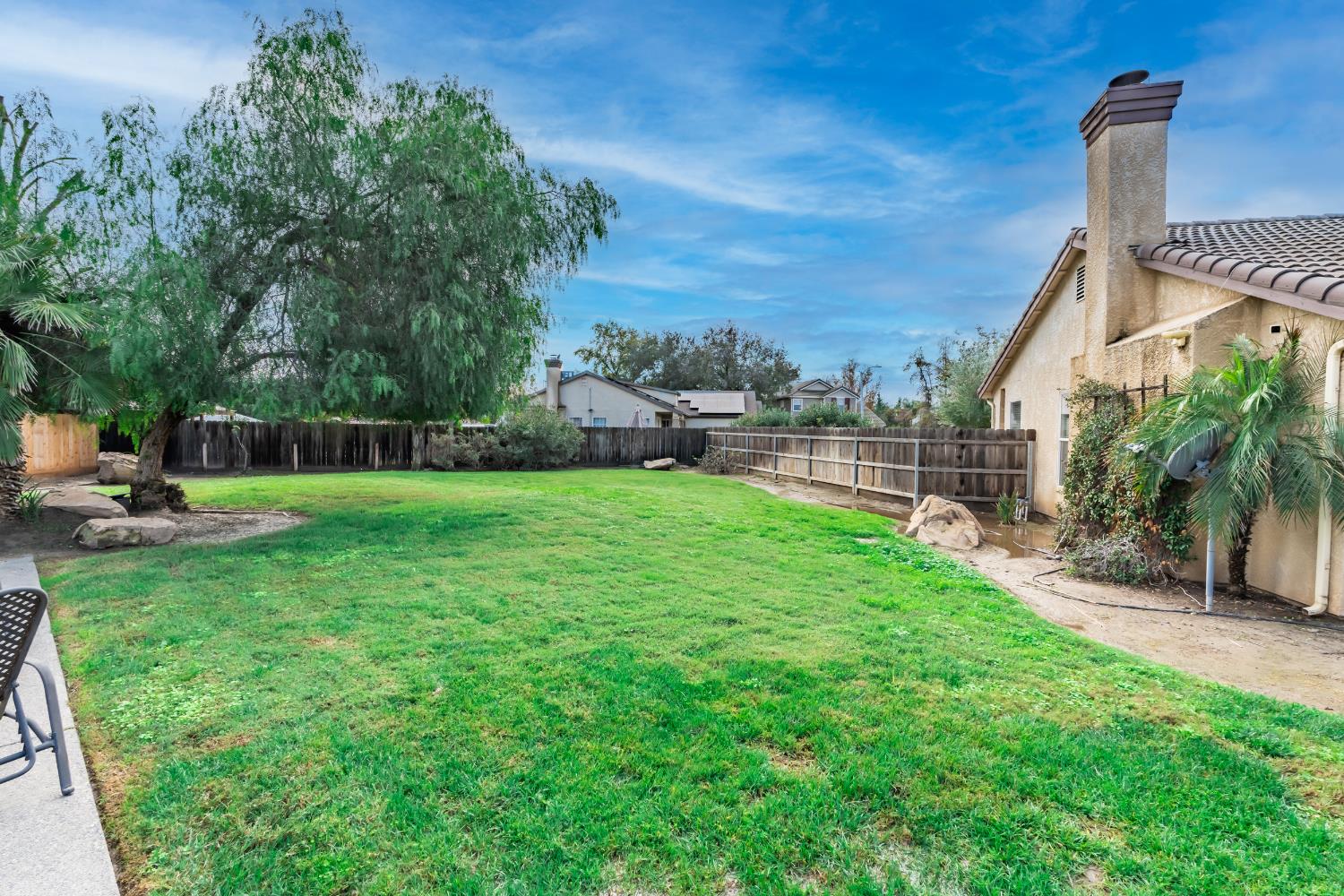 384 Millbrook Street Hanford, CA 93230 - Photo 55 of 59 a view of a garden with a slide