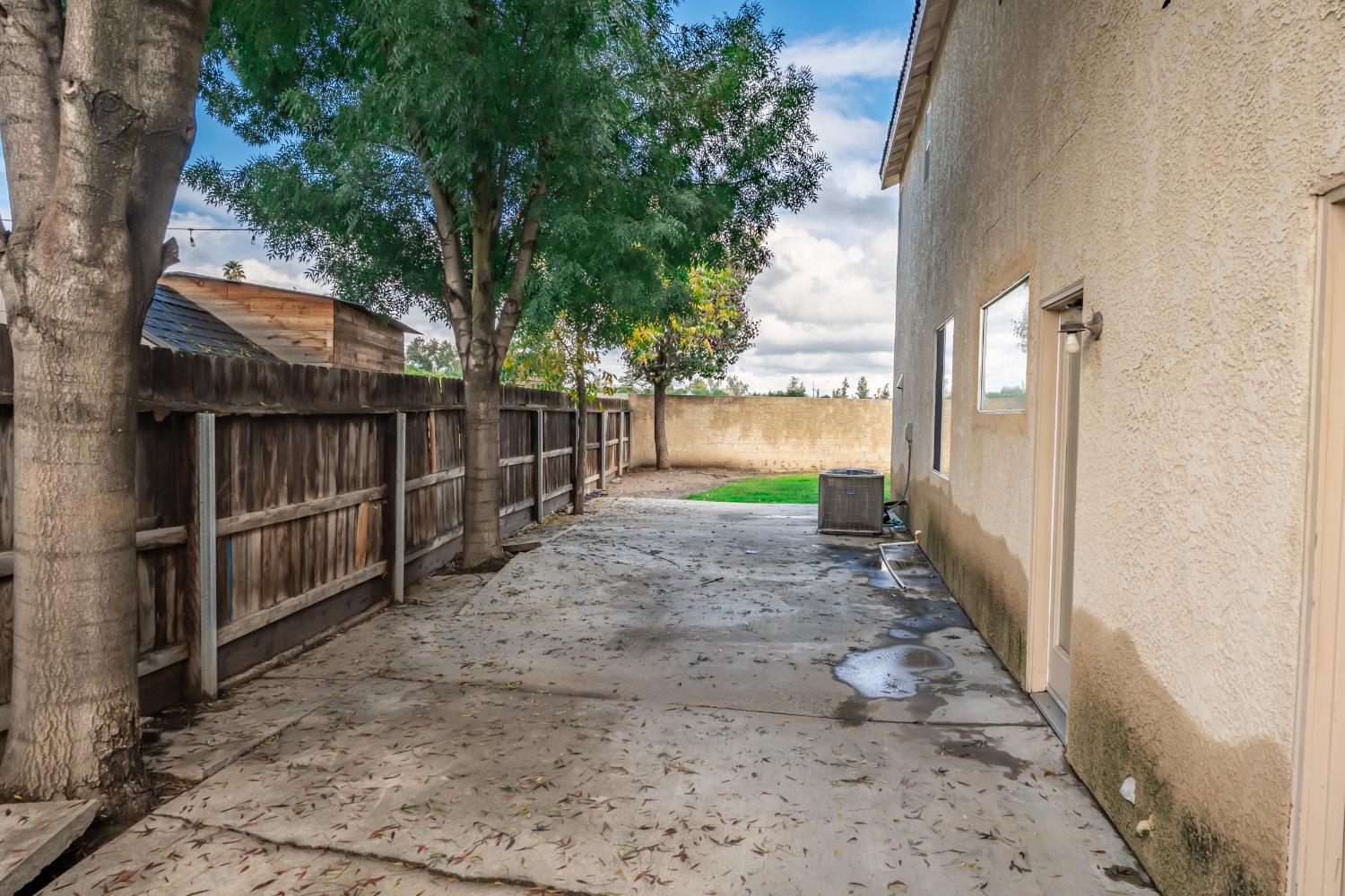 384 Millbrook Street Hanford, CA 93230 - Photo 56 of 59 a view of a pathway with a wrought fence
