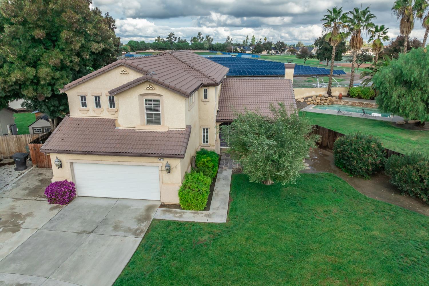 384 Millbrook Street Hanford, CA 93230 - Photo 57 of 59 a aerial view of a house with backyard