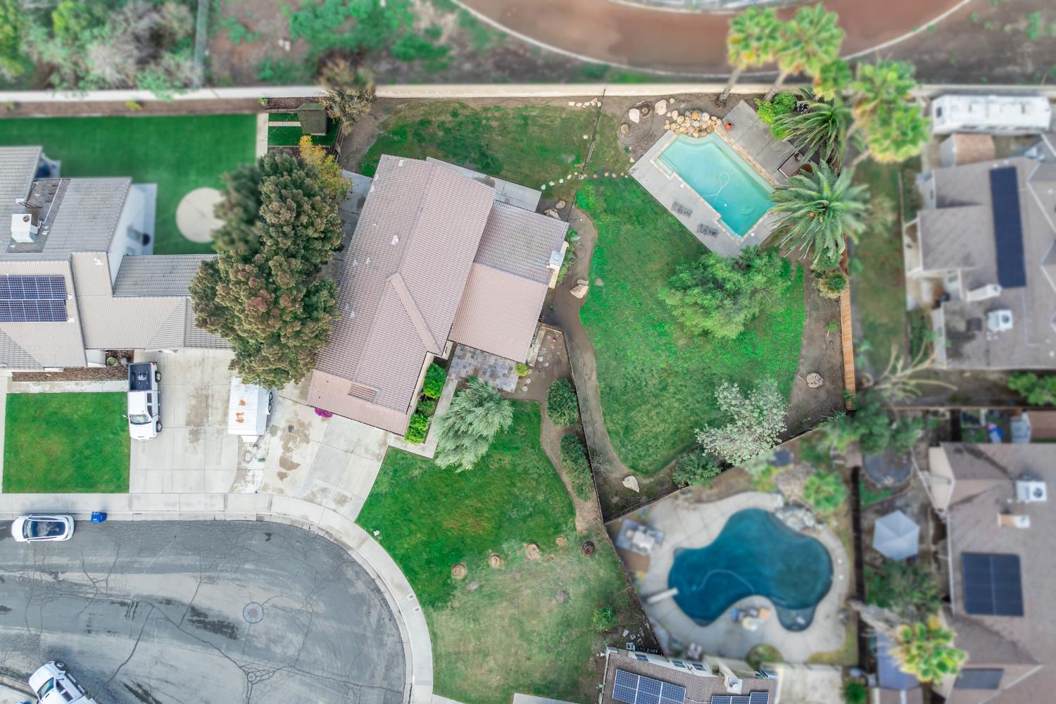 384 Millbrook Street Hanford, CA 93230 - Photo 58 of 59 an aerial view of a house with outdoor space and street view