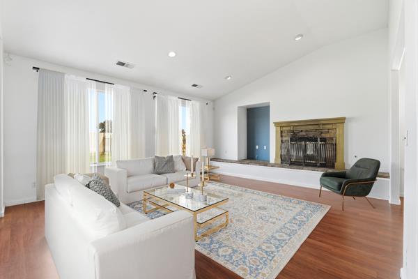 384 Millbrook Street Hanford, CA 93230 - Photo 7 of 59 a living room with furniture and a couch