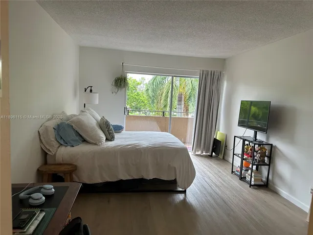 a balcony with view and wooden floor