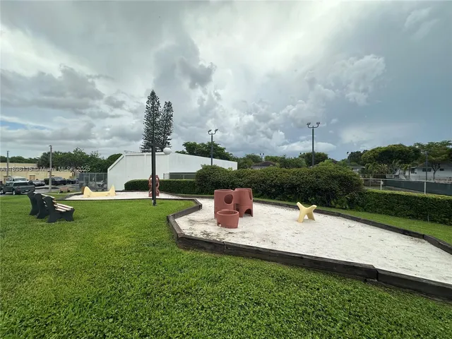 a view of house with swimming pool outdoor seating