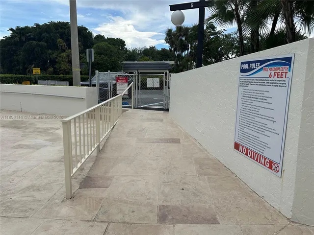 a view of swimming pool with outdoor seating and city view
