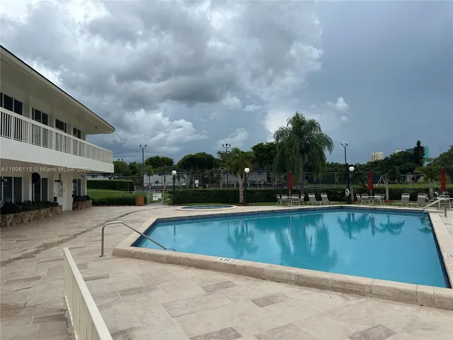 swimming pool view with seating space