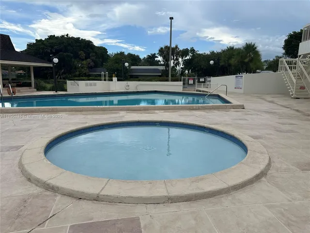 a view of a park with furniture