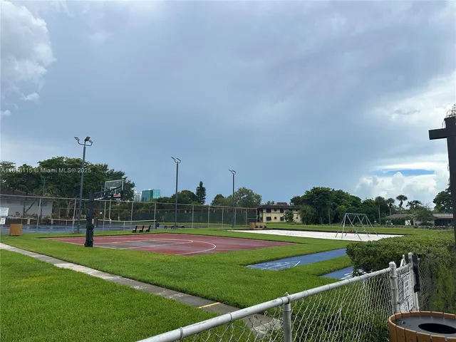a view of green field with trees
