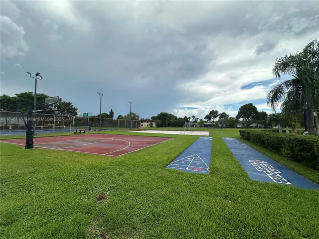 a view of street with parked cars